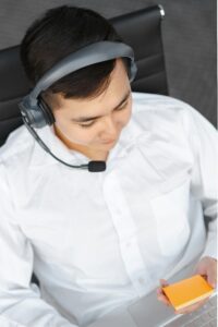 Professional customer service agent working remotely with a headset.